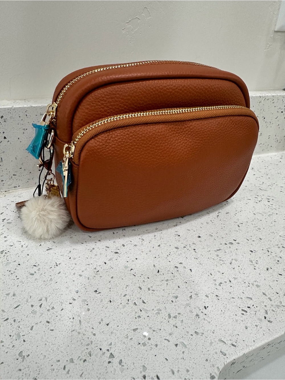 Women's Tan Double-Zip Crossbody Bag with Pom Charm